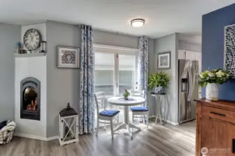 Cozy gas fireplace and deck access through the sliding door