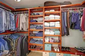 Large walk-in closet with built in shelving completes the primary suite.