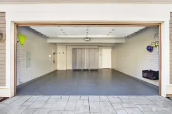 The garage of your dreams! Professionally installed, high-end Floortex epoxied floors, slat walls for hanging storage, spacious storage lockers and freshly painted walls.