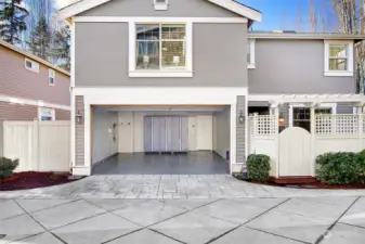 The garage of your dreams! Professionally installed high-end Floortex epoxied floors, slat walls for hanging storage, spacious storage lockers and freshly painted walls.