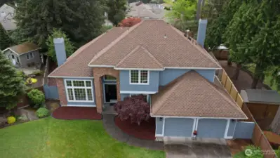 High-angle view highlighting the home’s setting