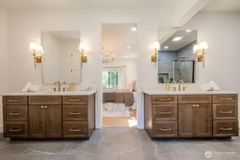 Spa-inspired primary bath with fabulous quartz topped vanities, LED mirrors & elegant brushed gold touches. Prepare to be pampered!