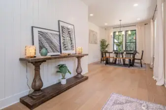 Entry opens to bright and spacious dining room with custom millwork, large windows, custom draperies, lighting and recessed lights. LOVE LOVE LOVE!!!