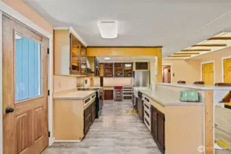 Kitchen with undercounter lighting and eating bar