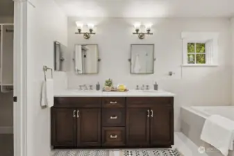 Primary ensuite full bathroom with Restoration Hardware fixtures.  Tiled floors have radiant heat.