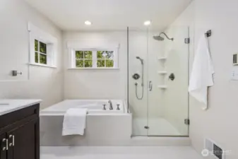Primary ensuite full bathroom with Restoration Hardware fixtures.  Tiled floors have radiant heat.