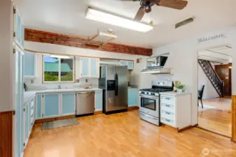 shown here is the generously sized kitchen with ample room for meal prep and everyday living.