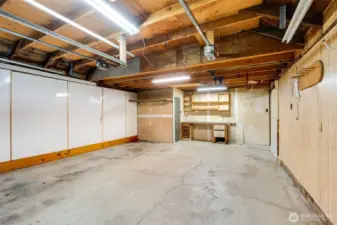 Convenient garage bathroom included—needs some TLC to restore to its full potential.