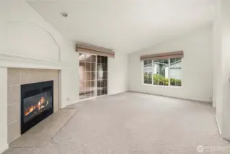 Slider exits to an enclosed patio.