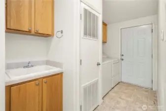 Utility room with sink and convenient garage access