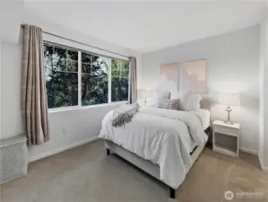 Spacious primary bedroom with huge windows!