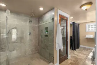 Glass shower surround in the lower level bathroom.