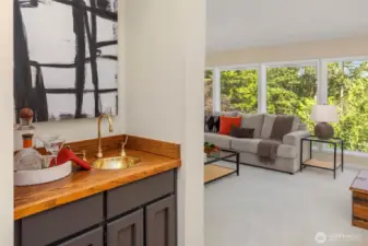 Wet bar between formal dining and living room