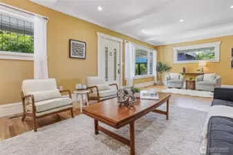 Leaded glass windows, box beam ceilings, detailed moldings and hardwood floors showcase the home’s beautiful period craftsmanship.