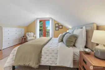 Primary suite with built-ins and a Romeo & Juliet deck offering mountain and territorial views.