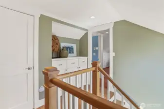 The top floor landing offers extra closet space and thoughtfully designed built-ins for optimal organization