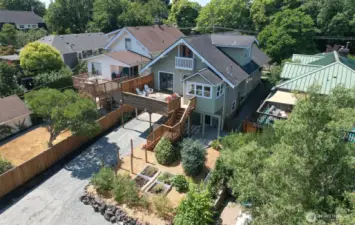 This generous property features alley access, plenty of off-street parking, and fantastic space for gardening enthusiasts.