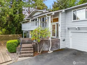 Front of home on view Side. Covered entry, multiple view decks.