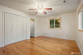 Primary bedroom on the main level. with two closets, and a 3/4 bath.
