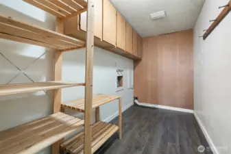 Nice size laundry room with built-in storage.