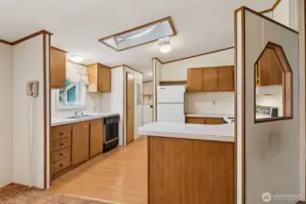 Spacious kitchen, with all appliances included and a skylight to bring in natural light.