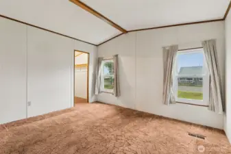 Primary bedroom with walk-in closet and attached full bath.