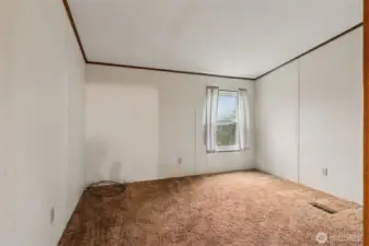 Bedroom #2. Split floorplan has primary bedroom on one side of the house and two additional bedrooms at the other end.