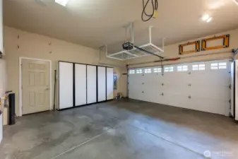 Garage comes with its own shelves and work bench for tons of storage