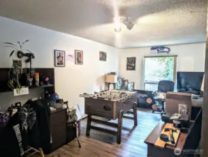 Spacious room on main is not part of the 5 bedrooms, but could be a 6th bedroom, office, flex space, etc.