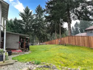 Fully fenced back yard with tons of potential for your backyard living & enjoyment.