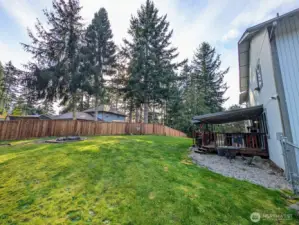 Another view of the huge back yard, deck & firepit.  RV/boat parking directly to the right.