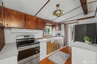 Kitchne has stainless steel refridgerator & oven.