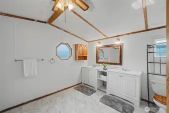 The ensuite bathroom has new flooring.