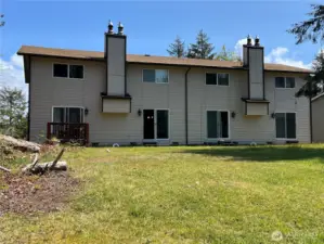 4 unit townhomes overlooking a nice grassy back yard. Unit B is the second one from the left.