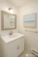 Virtually staged powder room. Would be a quick and inexpensive upgrade.