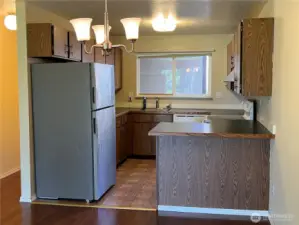 The kitchen has a new refrigerator, under a year old. All appliances stay, including upstairs washer and dryer.
