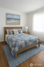 Virtually staged 1st bedroom. Current flooring.