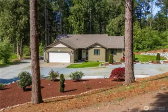 Mature evergreens surround this peaceful property.