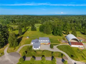 Aerial View of the 5+ acre lot. Does not include riding area and barn.