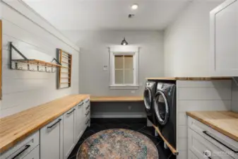 Counter space for folding cloths and built in laundry bins. One of two laundry rooms! Washer and dryers included.