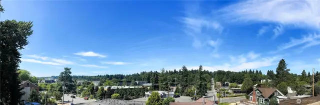 Panoramic photo taken from covered patio. Downtown Bothell to the left, staircase from Community to Downtown just steps from this unit!