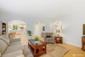 Spacious and lovely great room with kitchen eating area beyond.