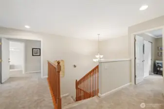 Balcony looking over to primary bedroom suite and to the right is the 3rd bedroom. Fantastic upper floor design.