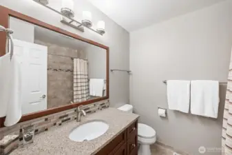 Full bathroom on the second floor. Tile and granite.