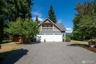 Large aggregate driveway for lots of parking. Work room/storage in the third bay of the garage.