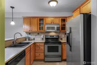 Efficient kitchen layout with stainless steel appliances.
