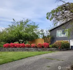 Paved Driveway to the Garage & side of the home.