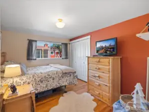 Bedroom #2 with wood floors, closet & view window.