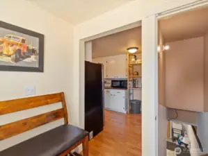 Kitchen leads to Laundry Room with a door to the lower level.