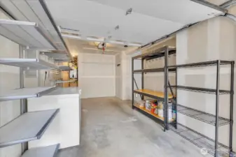 spacious garage! Shelving and freezer convey